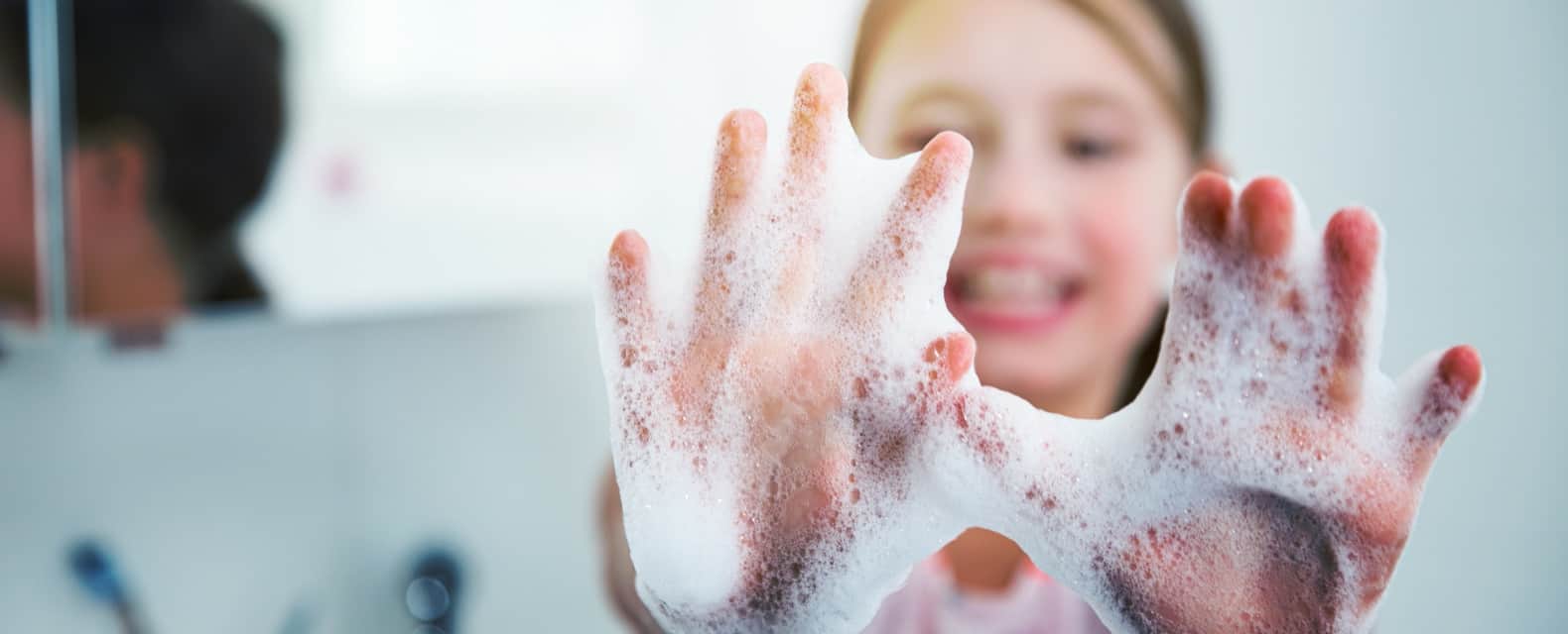 Image of hand washing in a school environment